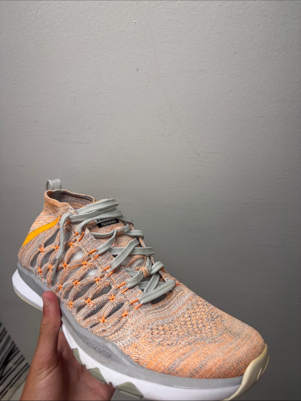 Nike Light Orange Knit Trainer with Grey Laces and Yellow Swoosh